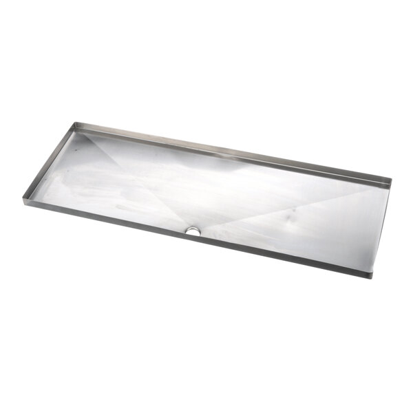 A rectangular metal drain pan with a hole in it.