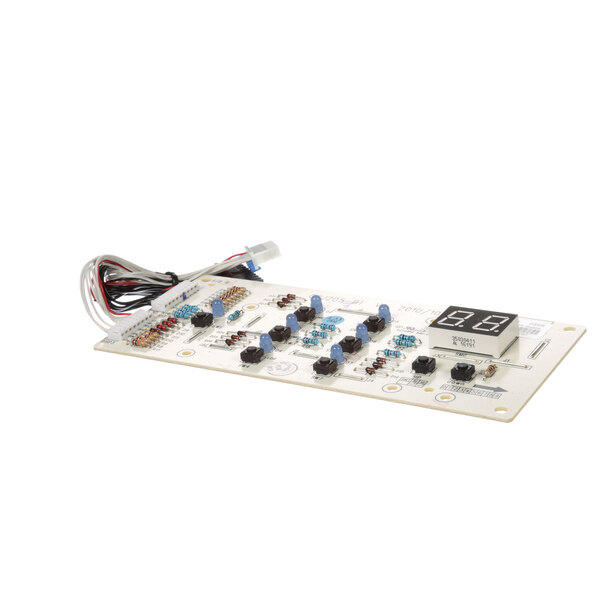 A white Friedrich display board with a digital display, buttons, and wires.