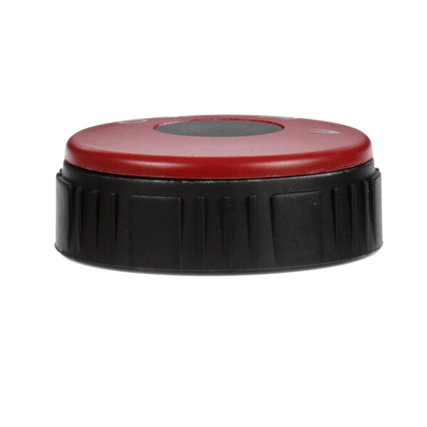 A close-up of a red and black Rosito Bisani gas valve knob.