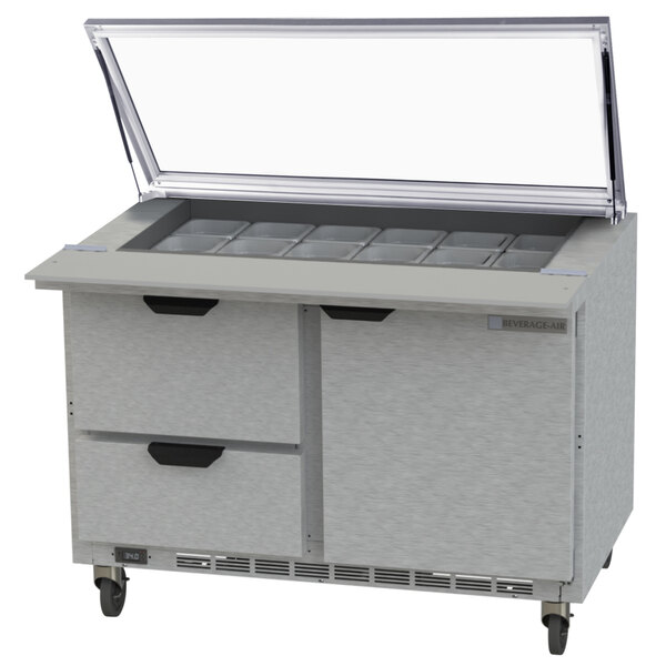 A Beverage-Air stainless steel refrigerator with drawers open.