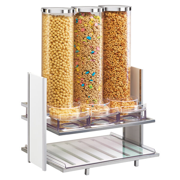 A white Cal-Mil cereal dispenser filled with cereal.