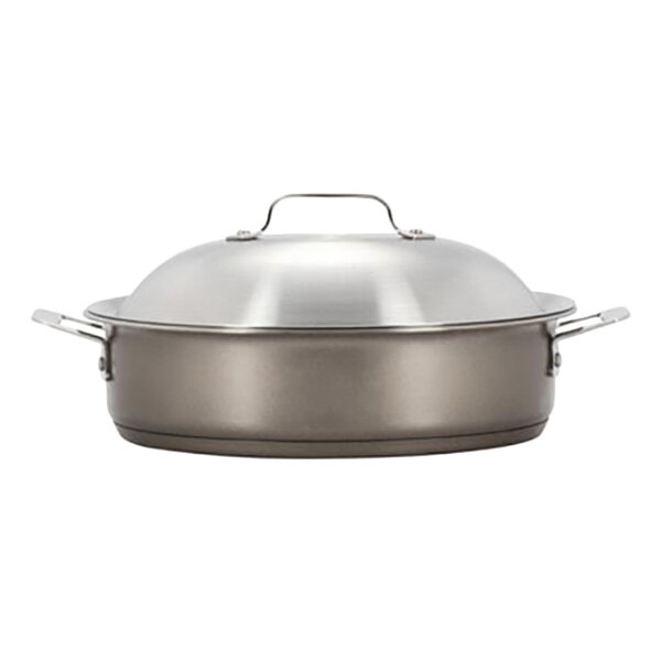 A Bon Chef stainless steel round brazier with a taupe lid.