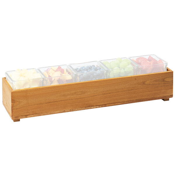 A Cal-Mil wood stacking box with containers of fruit on a table in a salad bar.