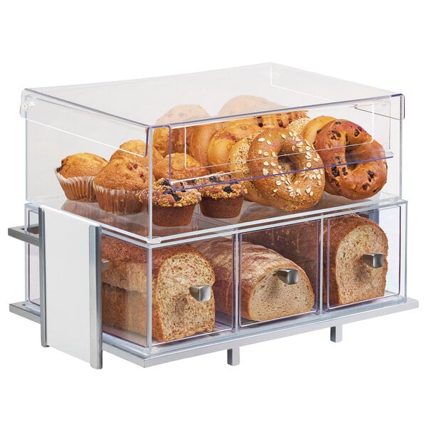 A Cal-Mil Eco Modern white display case with bread, pastries, and bagels.