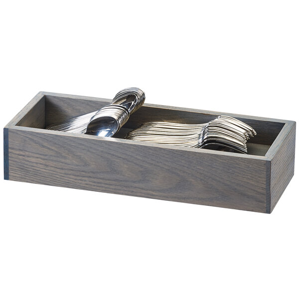 A wooden Cal-Mil Ashwood flatware organizer with silverware in it.