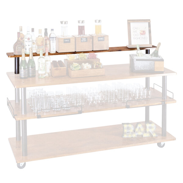 A Cal-Mil Sierra U-Build top shelf with bottles and glasses on it.