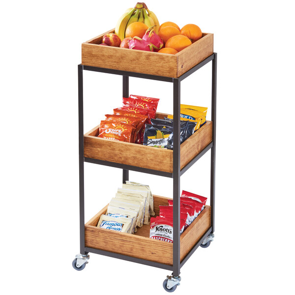A Cal-Mil Sierra 3-tier merchandiser cart with fruit in the bins.