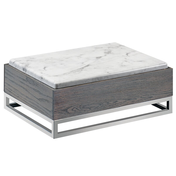 A Cal-Mil Ashwood Gray Oak wood riser with a white and gray marble tray on metal legs.