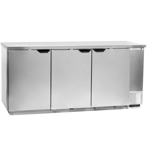 A Beverage-Air stainless steel back bar refrigerator with three solid doors.