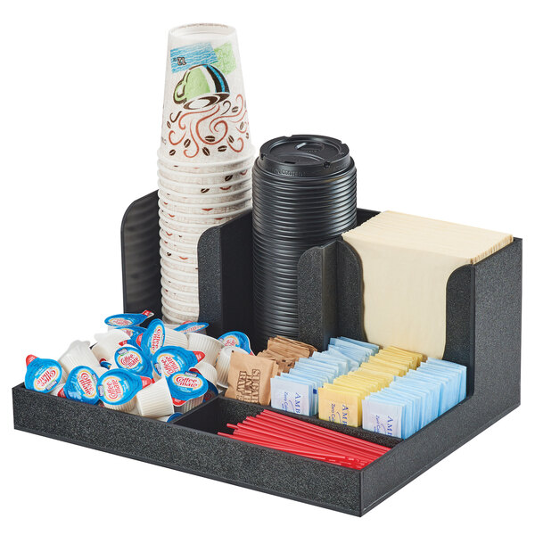 A black Cal-Mil countertop organizer with cups, condiments, and napkins.