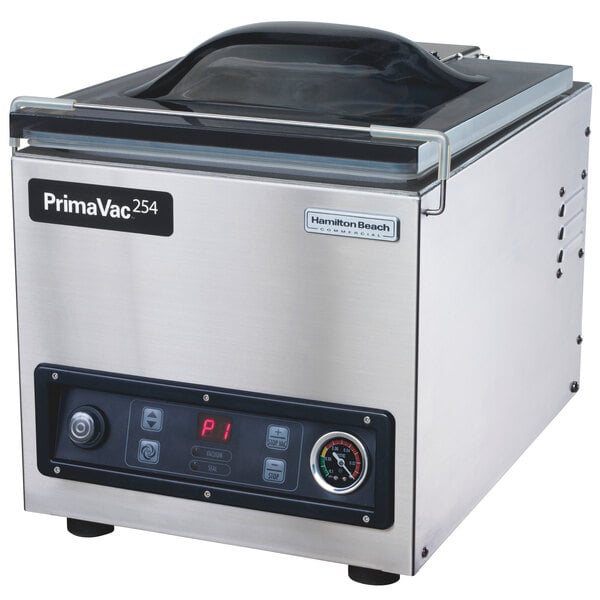 A Hamilton Beach PrimaVac 254 chamber vacuum sealer on a counter with a lid and buttons.