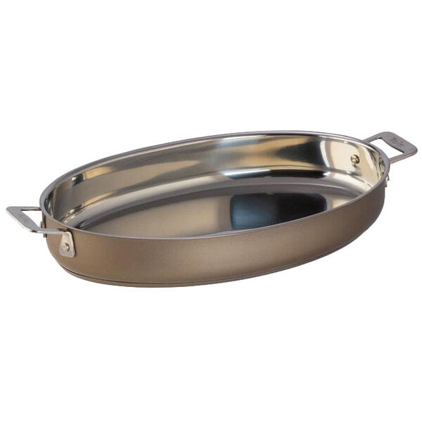 A Bon Chef stainless steel oval au gratin dish with handles.