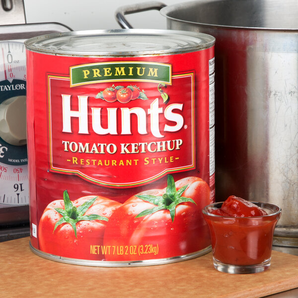 A Hunt's can of tomato ketchup on a kitchen counter.