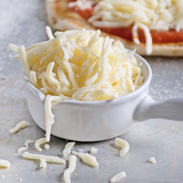 A close-up of a pizza with Great Lakes shredded mozzarella and provolone cheese.