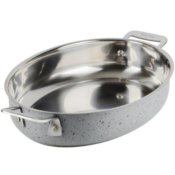 A silver stainless steel Bon Chef oval au gratin dish with handles.