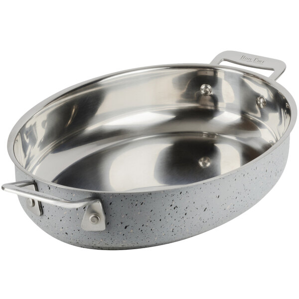 A Bon Chef stainless steel oval au gratin dish with handles.