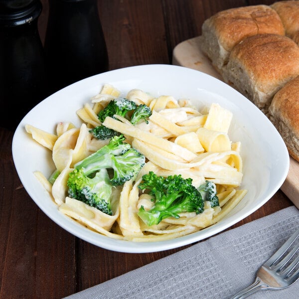 A bowl of Little Barn wide egg noodles with broccoli.