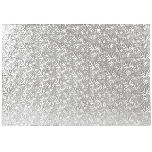 A white and silver patterned Enjay full sheet silver cake board.