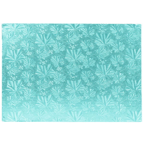 A blue rectangular Enjay cake board with a white pattern of leaves.