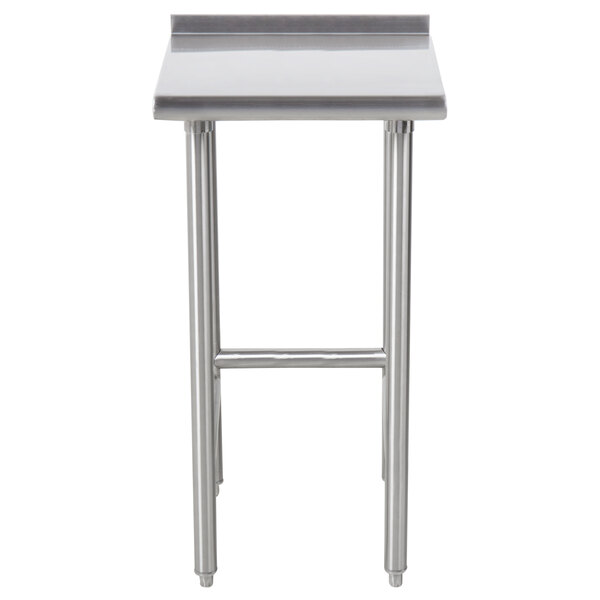 An Advance Tabco stainless steel filler table with a metal top.