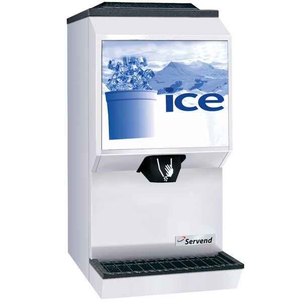 A white Servend countertop ice dispenser with a pile of ice in front of it.