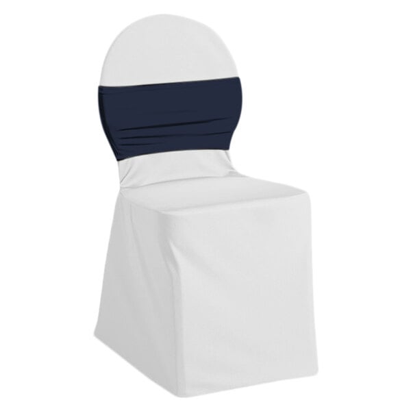 A white chair with a navy blue Snap Drape Silhouette II chair cover band.