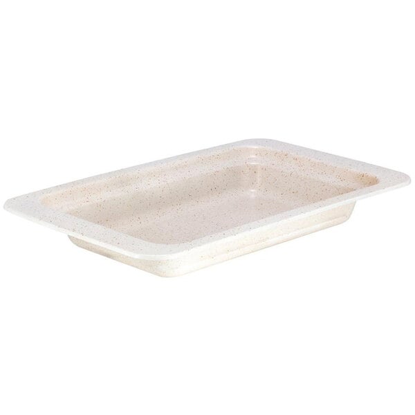 A rectangular beige food pan with a white interior.