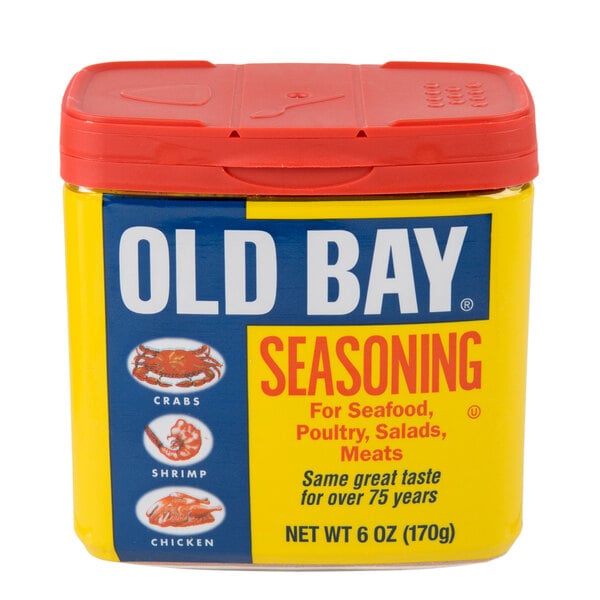 A yellow container of Old Bay Seasoning with a red lid.
