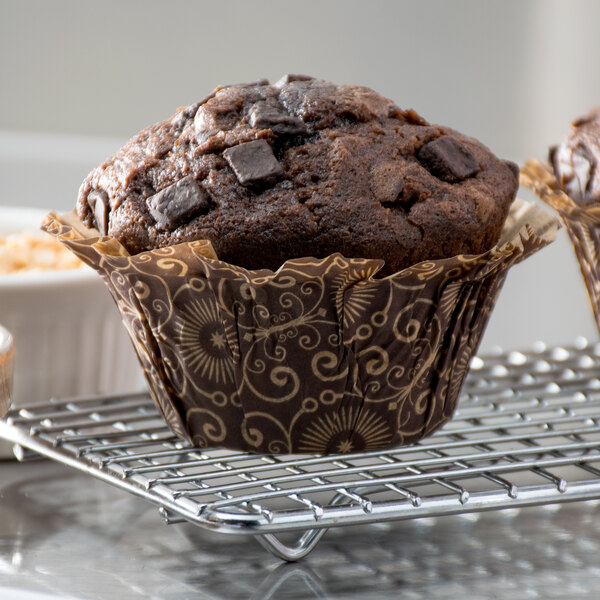 A dark brown Mariposa muffin in a brown and white Enjay wrapper.