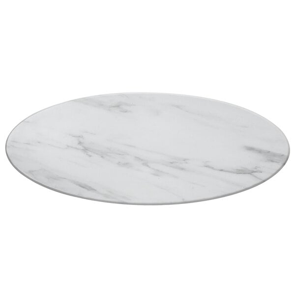 An American Metalcraft oval melamine serving board with a faux white marble design on a white table.