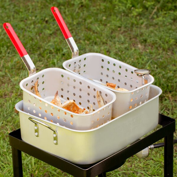 Two Backyard Pro fry baskets with red handles.