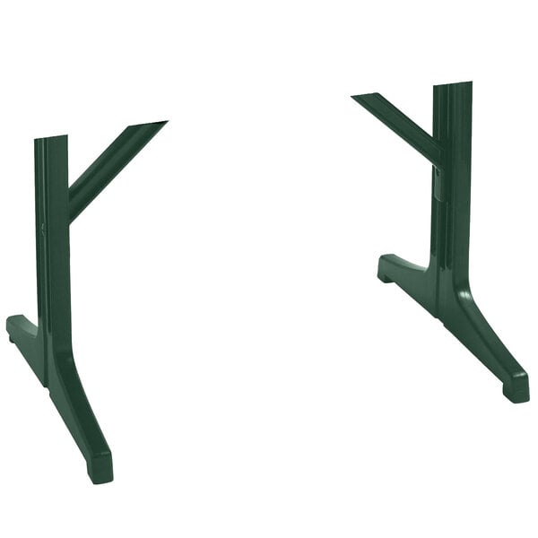 A pair of green plastic table legs for a Grosfillex Alpha table base.