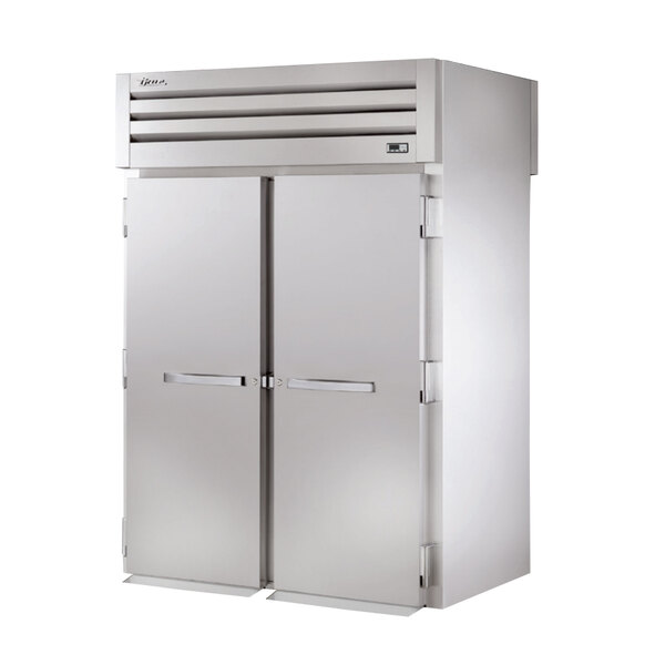 A True roll-through heated holding cabinet with two white doors.