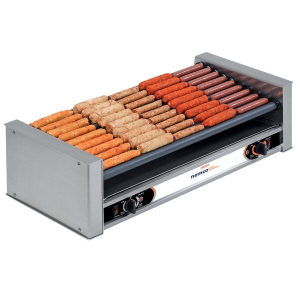 A Nemco hot dog roller with hot dogs on it.