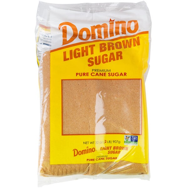 A close up of a plastic bag of Domino light brown sugar.