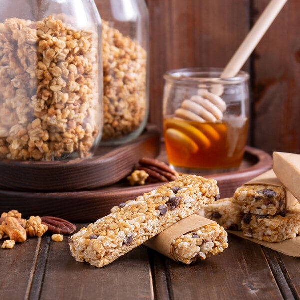 A close up of a Schlabach Amish Bakery Grand-Ola bag of granola with honey and nuts.