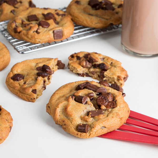 A David's Cookies triple chocolate chip cookie on a red fork.