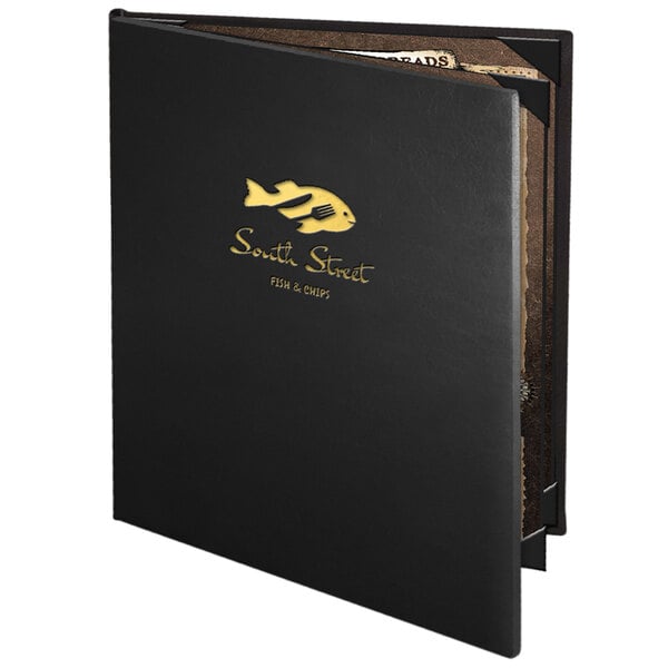 A black Menu Solutions Chadwick Collection leather-like menu cover with gold text on a table in a seafood restaurant.