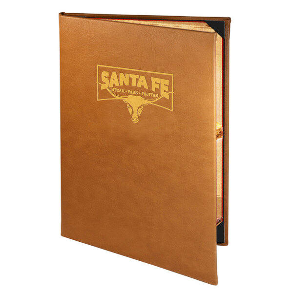 A brown leather Menu Solutions Bella Collection booklet menu cover on a table with a gold logo.