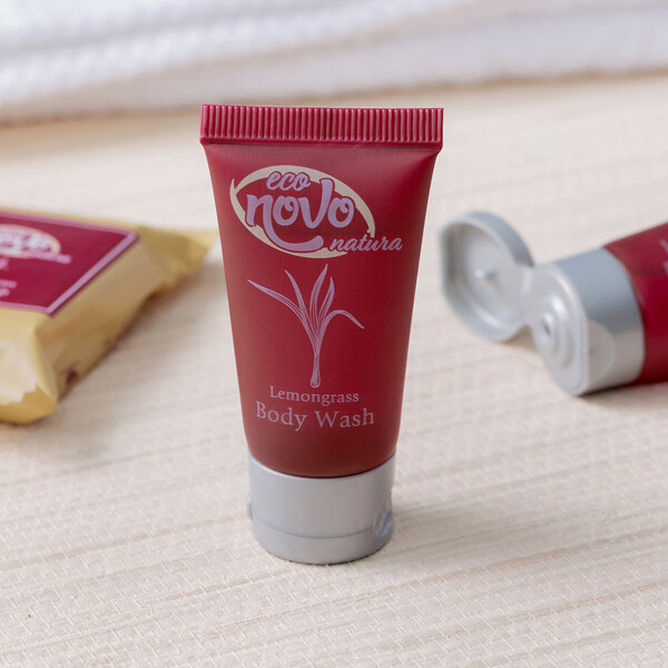 Two small red tubes of Noble Eco Novo Natura body wash with white text on them.