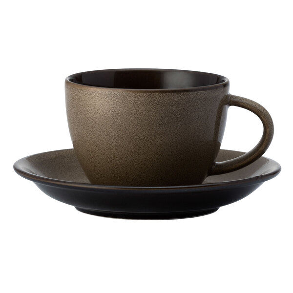 A brown Oneida Rustic espresso cup and saucer on a table.