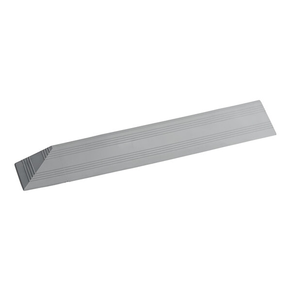 A grey rectangular vinyl ramp with lines on it.