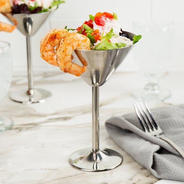 A shrimp cocktail in a Tablecraft stainless steel martini glass.