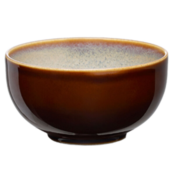 A brown Oneida Sama porcelain bowl with a white speckled rim.