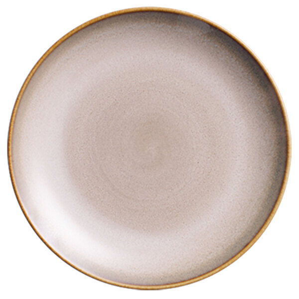A white porcelain coupe plate with a brown rim.