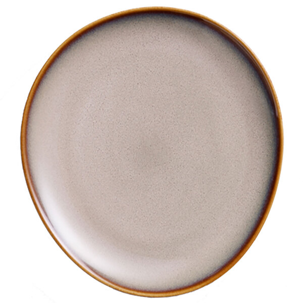 A close up of a Oneida Sama porcelain oval coupe plate with a white surface and brown rim.