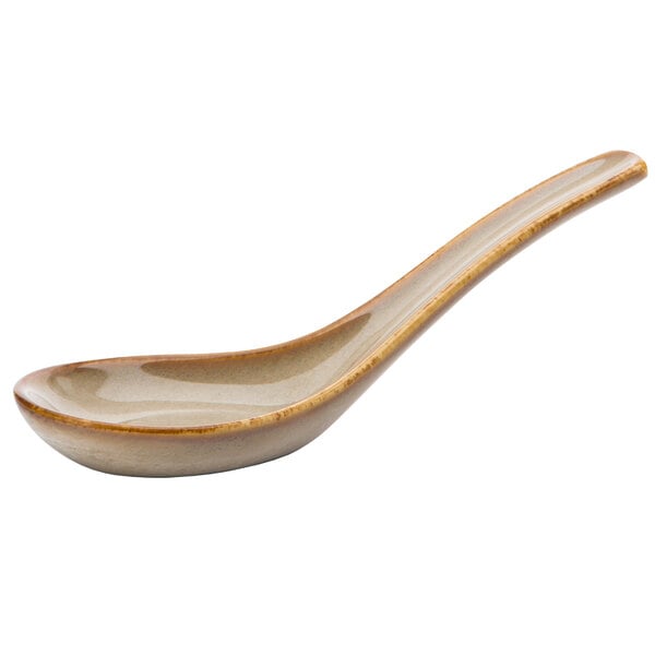 A Oneida Sama porcelain spoon with a brown handle.