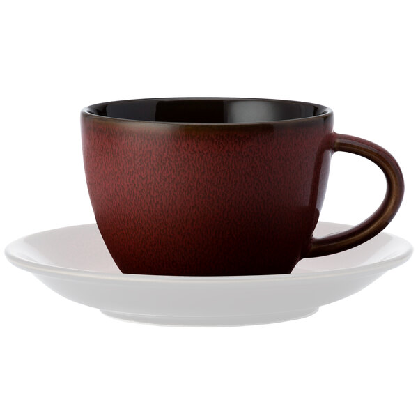 A brown Oneida Rustic porcelain teacup on a white saucer.