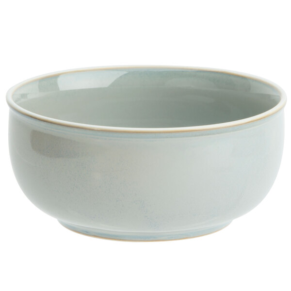 A white Oneida porcelain bowl with a light blue rim.
