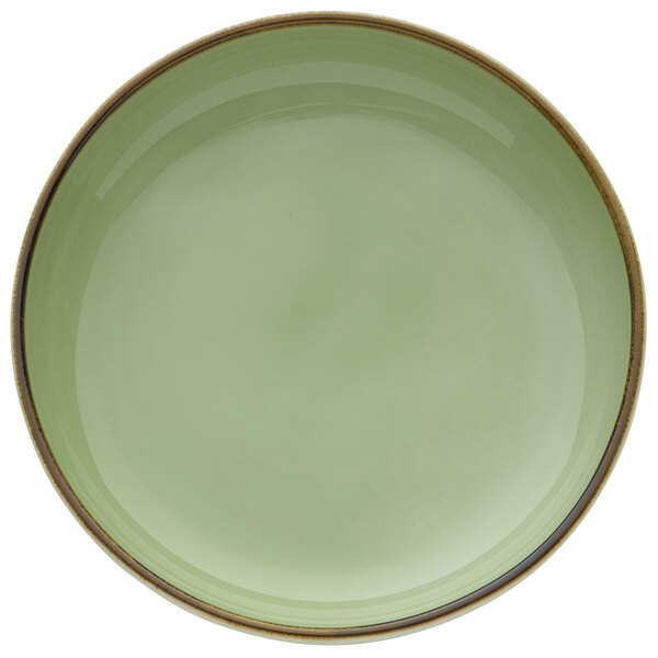 A celadon green porcelain tapas dish with a brown rim.